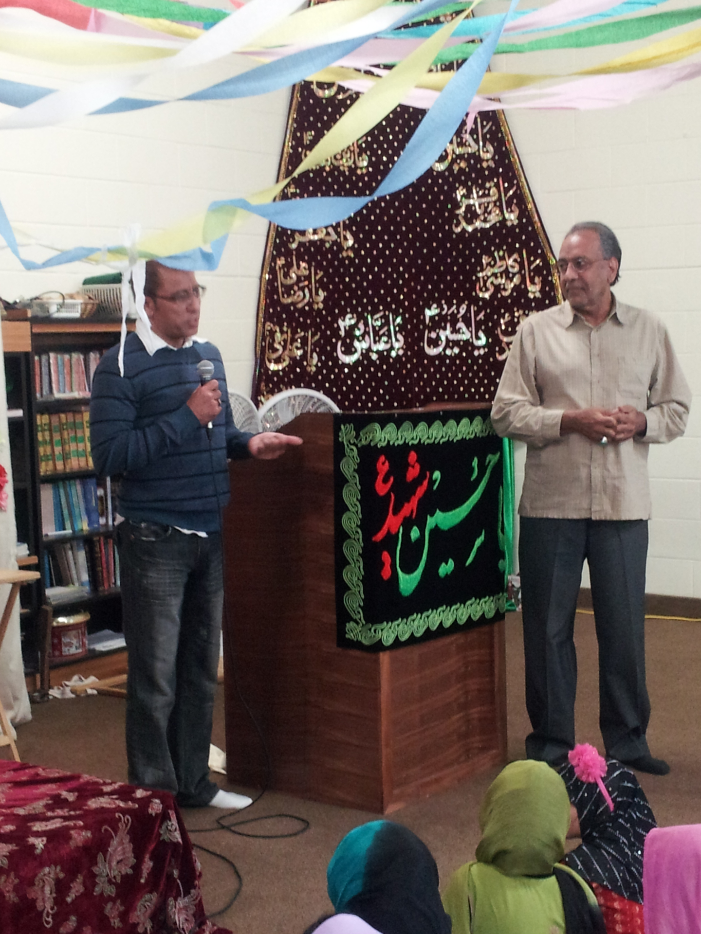 Speakers addressing students at an academy gathering