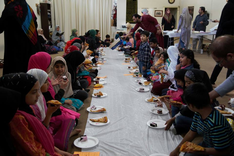 Students and families sharing a celebration meal
