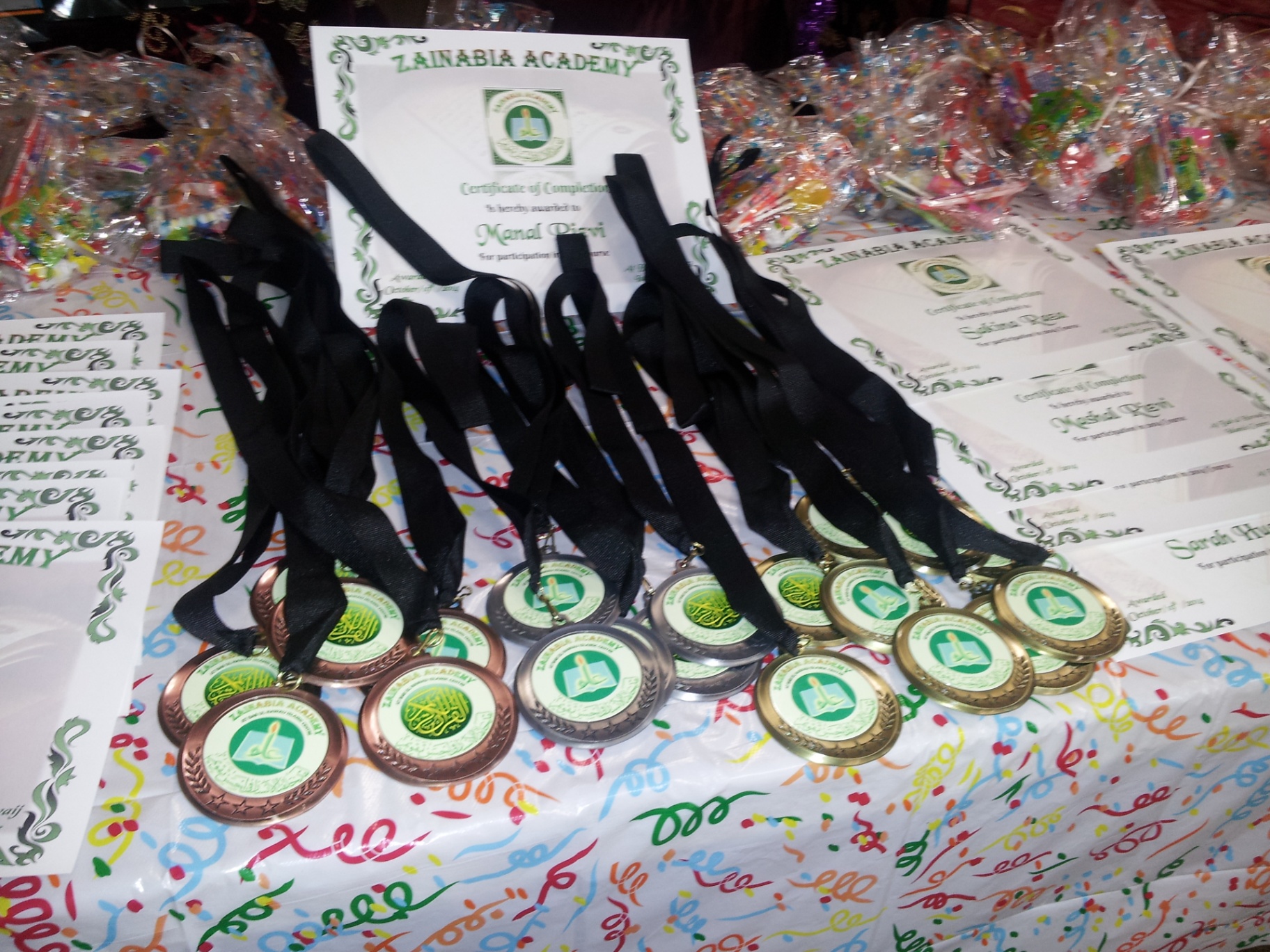 Academy medals and certificates displayed for students