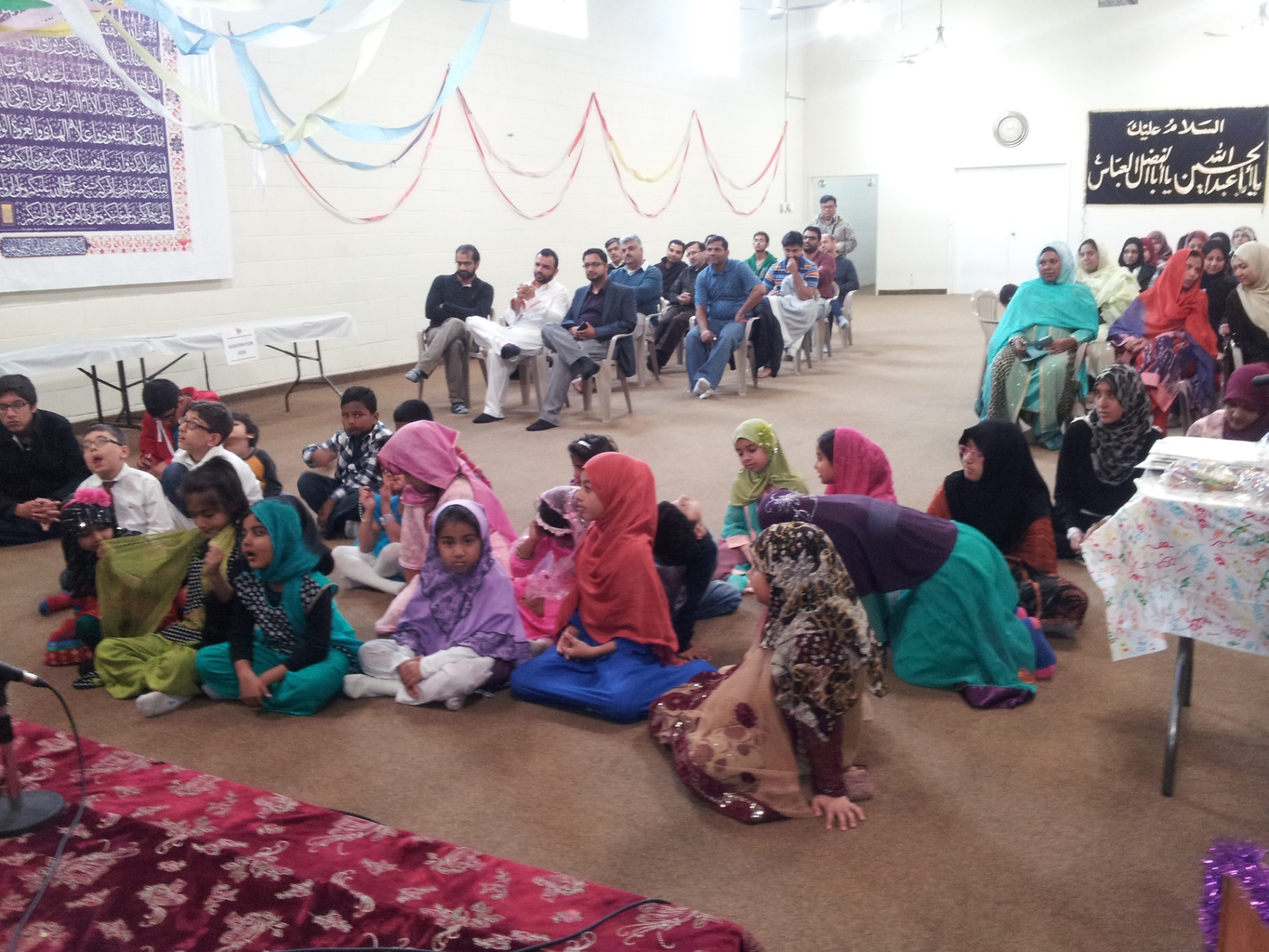 Students and families attending an academy gathering